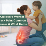 Childcare worker lifting toddler showing common cause of back pain in daycare workers